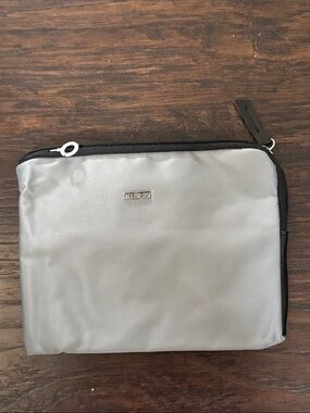 Tumi Silver and Black Toiletry Pouch – Compact Travel Organizer